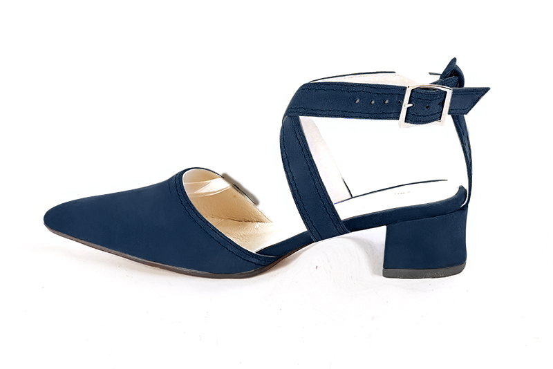 Navy blue women's open back shoes, with crossed straps. Tapered toe. Low flare heels. Profile view - Florence KOOIJMAN